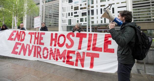 Monday April 30, 2018. Protestors from Global Justice Now demonstrate outside the Home Office in London demanding an end to the Hostile Environment policy, ahead of parliamentary debate on the Windrush scandal. Photo: David Mirzoeff/Global Justice Now